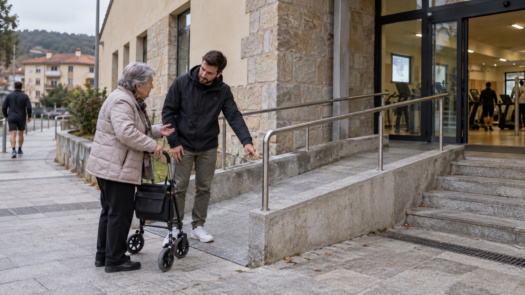 Adulți evaluează accesul la intrarea unei clădiri sportive urbane.